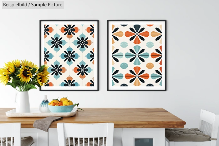 Dining room with wooden table, sunflowers in vase, fruit bowl, and two abstract floral prints on the wall.