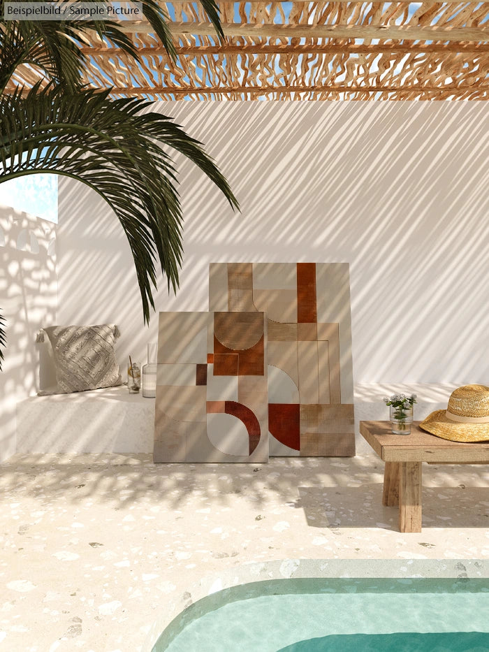 Sunlit patio with abstract art, palm shadows, and a poolside table with a hat and drink.