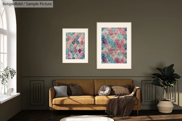 Two colorful framed geometric artworks on a green wall above a brown sofa with cushions in a well-lit living room.