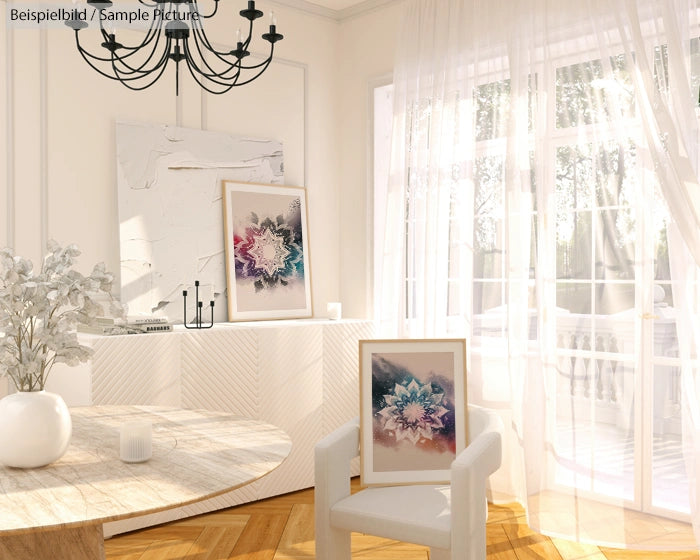 Bright living room with abstract art, white furniture, and sheer curtains allowing natural light to fill the space.