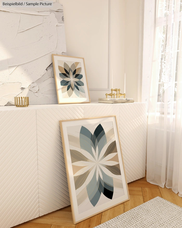 Interior with modern geometric artwork, wooden floor, light walls, and a sunlit window.