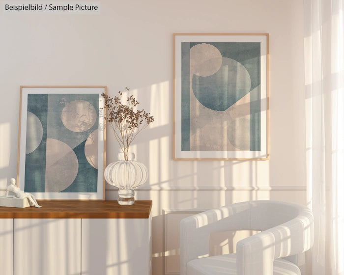 Minimalist room with abstract geometric art on walls, dried flowers in vase, and sunlight casting soft shadows.