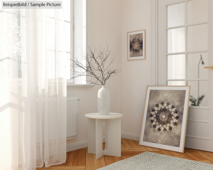 Bright room with abstract geometric art, tall white vase on small table, sheer curtains, and parquet flooring.