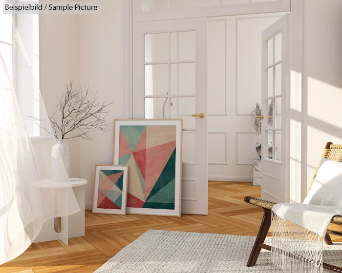 Modern interior with abstract geometric art, wooden floor, and wicker chair in bright natural light.