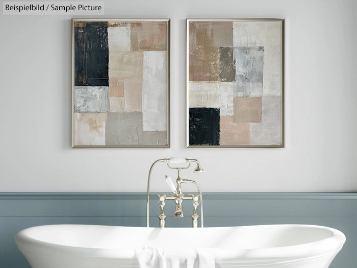 Freestanding bathtub with abstract art paintings on the wall in a modern bathroom.