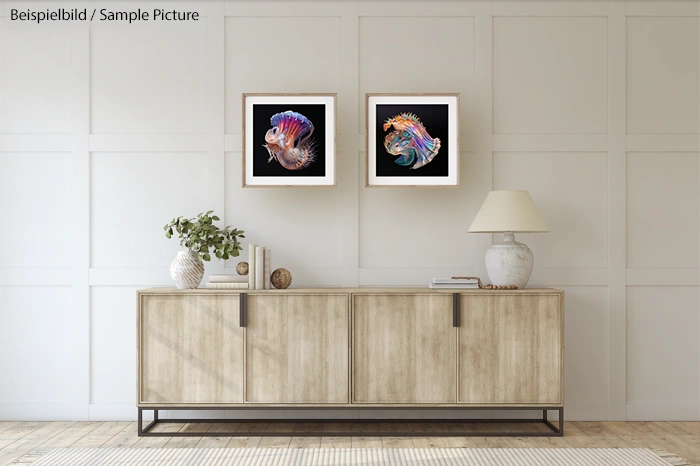 Modern living room with wooden cabinet, decorative items, and two framed artworks on the wall.