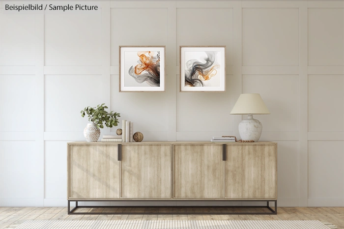 Modern living room with wooden sideboard, decorative items, and abstract wall art in neutral tones.