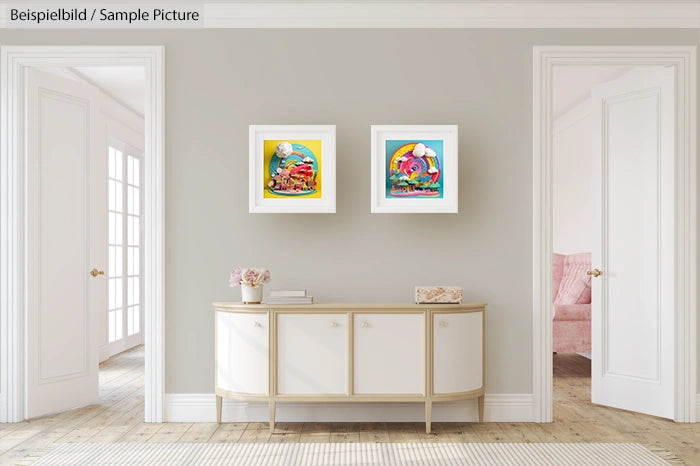 Modern living room with two colorful framed artworks above a light-colored sideboard, brightened by natural light.