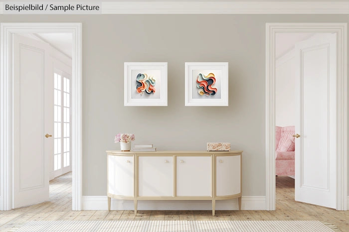 Elegant hallway with white sideboard, abstract art on walls, and open doorways leading to bright rooms.