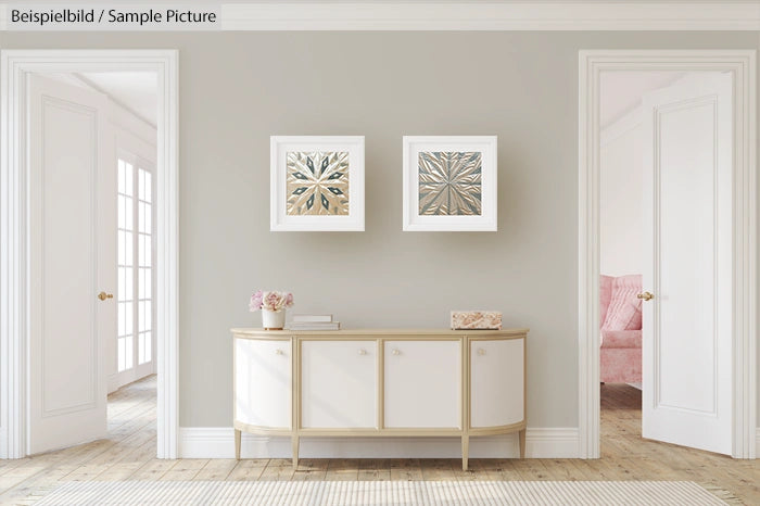 Elegant living room with wall art, modern white sideboard, and soft pink chair visible through doorways.