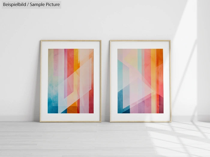 Two framed abstract geometric prints with colorful gradients on a white wall.