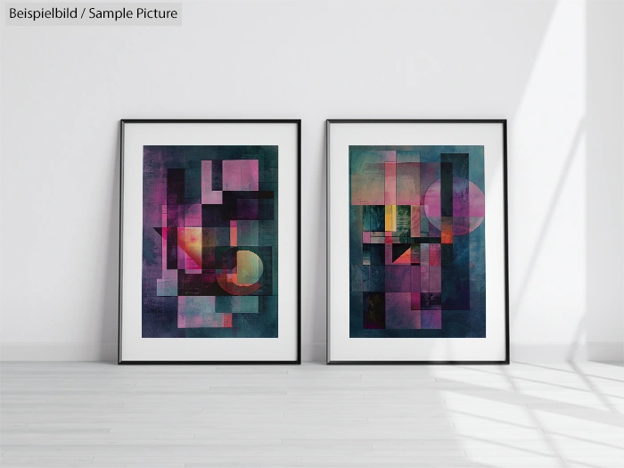 Two framed abstract artworks with geometric shapes in vibrant colors on a hardwood floor against a white wall.