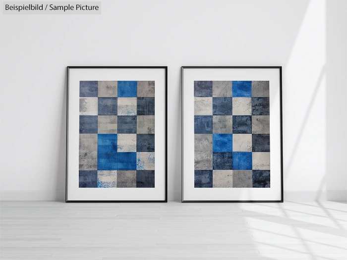 Two framed abstract artworks with blue and gray checkered patterns displayed on a minimalist white wall.