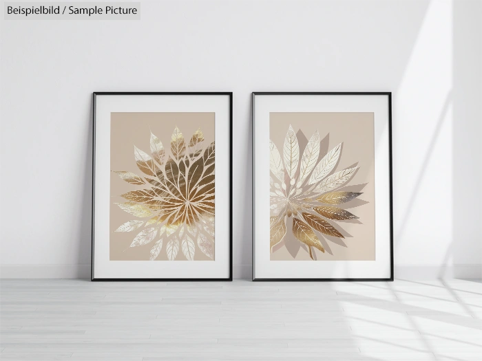 Two framed leaf-pattern artworks with gold and silver tones on beige background, displayed against a white wall.