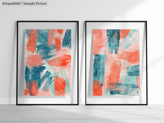 Two framed abstract paintings with blue, teal, and coral brushstrokes on display in a well-lit room.