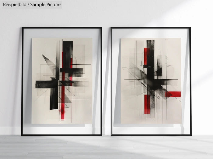 Pair of abstract paintings with bold black and red geometric shapes in minimalist frames on a white wall.