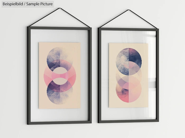 Two framed abstract artworks with overlapping circles in pink, blue, and purple hues on a beige background.