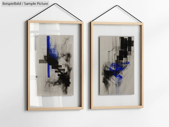 Abstract art with blue, black, and gray geometric patterns in wooden frames, hanging on a white wall.