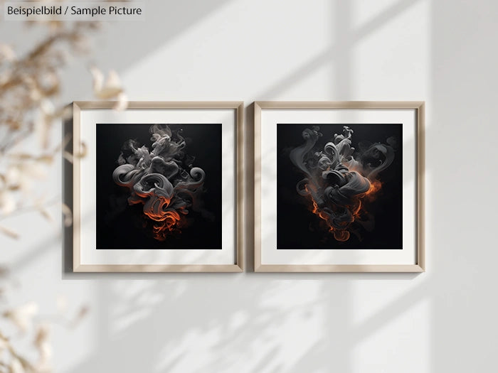 Two framed abstract smoke artworks with beige frames on a wall, featuring swirling gray and orange smoke patterns.