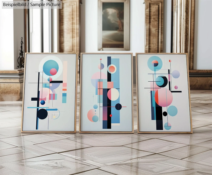 Framed geometric art prints with circles and lines on a reflective wooden floor in a classic room.