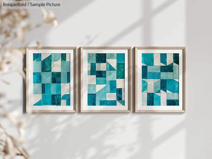 Triptych of abstract teal and white geometric art pieces in frames on a wall.