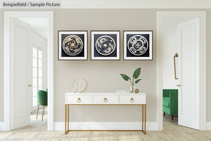 Modern hallway with white console table, three circular patterned artworks, and green chair in a bright interior.