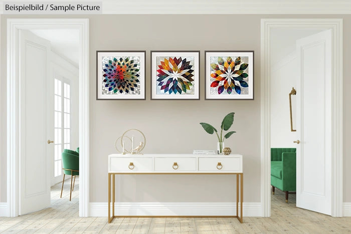 Modern hallway with white console table, potted plant, and three colorful abstract art prints on the wall.