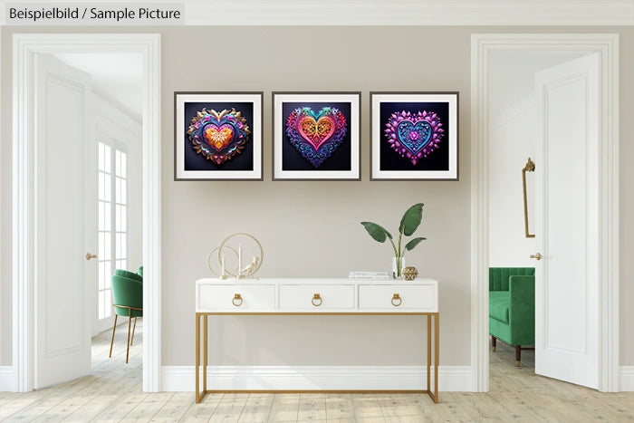 Modern living room with three framed heart artworks on wall above a white console table with plants.