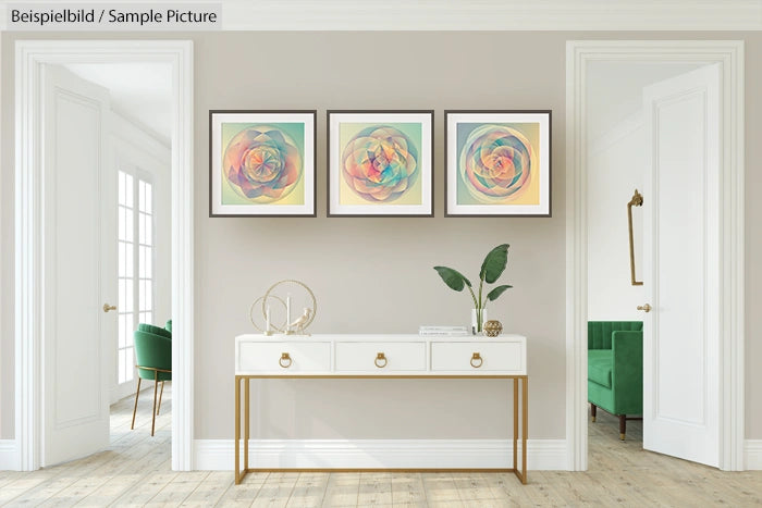 Bright room with three abstract paintings on a wall above a console table, featuring pastel geometric designs.