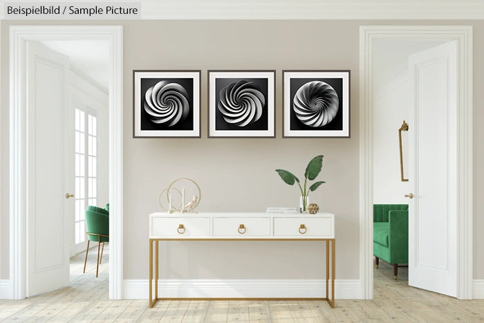 Modern living room with three black and white abstract swirl paintings above a white console table with decor.