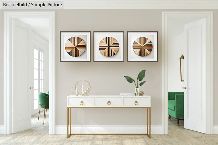 Minimalist living room with white table, abstract art, and plants against a beige wall.