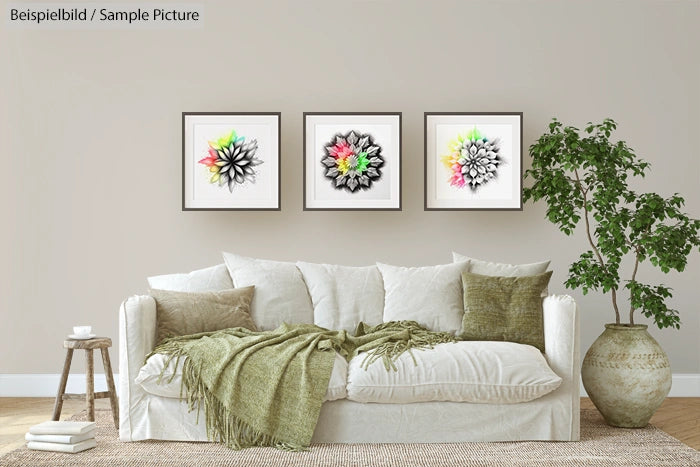 Modern living room with white sofa, green cushions, wall art, and a potted plant on wooden floor.