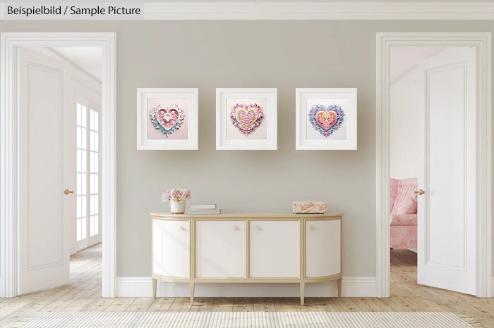 Elegant hallway with heart-themed wall art above a modern sideboard, flanked by doorways and soft natural lighting.