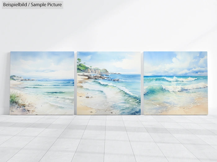 Three beach landscape paintings depicting waves, sandy shores, and distant cliffs, placed side by side in a sunlit gallery.