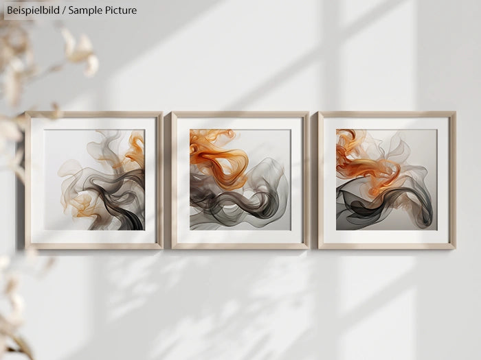 Three abstract framed artworks with flowing orange and gray patterns on a wall with soft shadows.