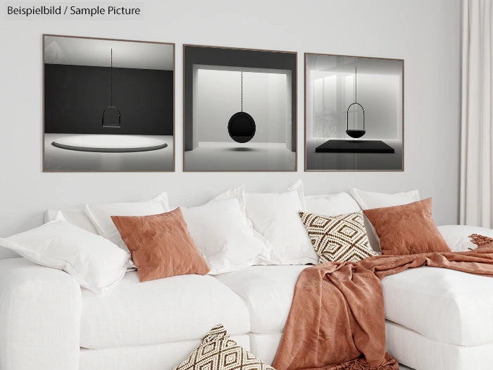 Modern living room with white sofa, brown cushions, and abstract black-and-white art on the wall.