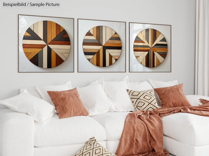 Modern living room with three geometric wood circle art pieces on wall above a white sofa with brown and white pillows.