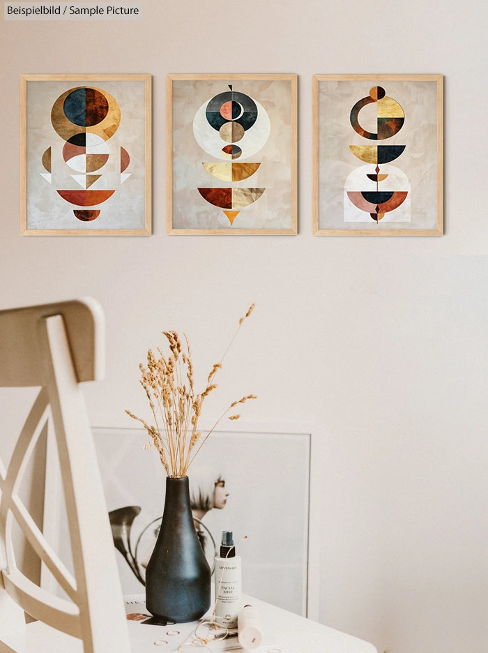 Modern room with abstract art on wall, vase with dried flowers, and a chair in the foreground.