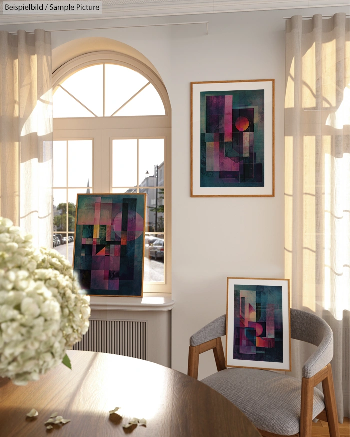 Bright room with abstract geometric paintings on walls, arched window, draped curtains, and a table with hydrangeas.