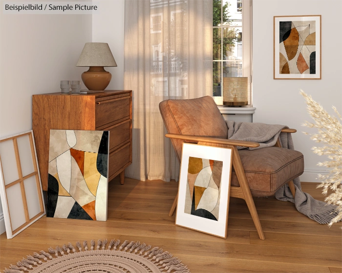 Cozy living room with abstract art, armchair, wooden cabinet, and sunlit window; warm earth tones and dried pampas grass.