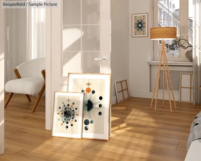 Cozy room with modern art prints, floor lamp, and wooden floor. Sunlight casts shadows through window.