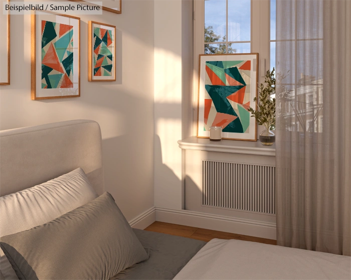 Bright bedroom with bed, geometric artwork on walls, and sunlight streaming through the window onto sheer curtains.