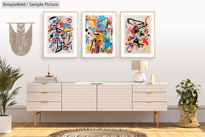 Modern living room with three colorful abstract paintings, a textured white credenza, plants, and wall decor.