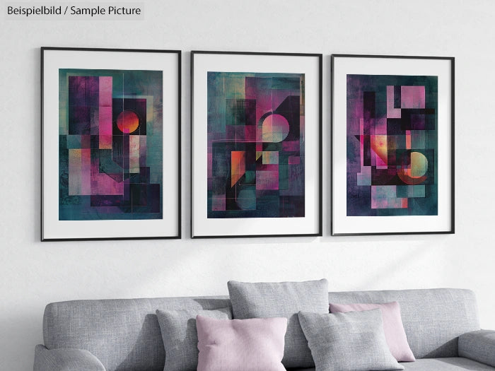 Three framed abstract paintings with bold geometric shapes in pink, purple, and teal tones on a white wall.