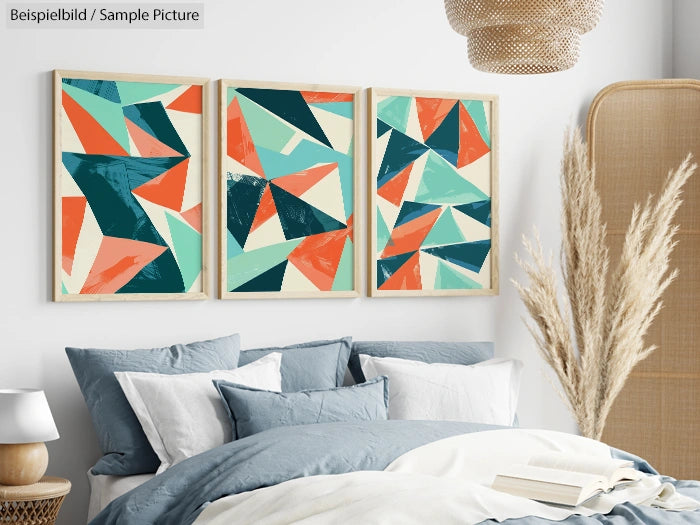 Modern bedroom with abstract art triptych above bed, blue and gray bedding, and pampas grass decor.