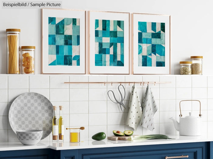 Modern kitchen with teal geometric art and blue cabinets, featuring kitchenware and food on a white tiled backsplash.