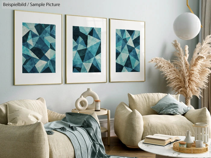 Modern living room with beige armchairs, blue-green abstract art, pampas grass, and round white pendant light.