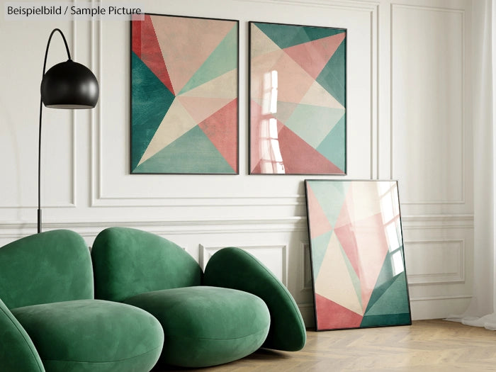 Modern living room with green sofa, geometric abstract art on wall and floor, and a black floor lamp.