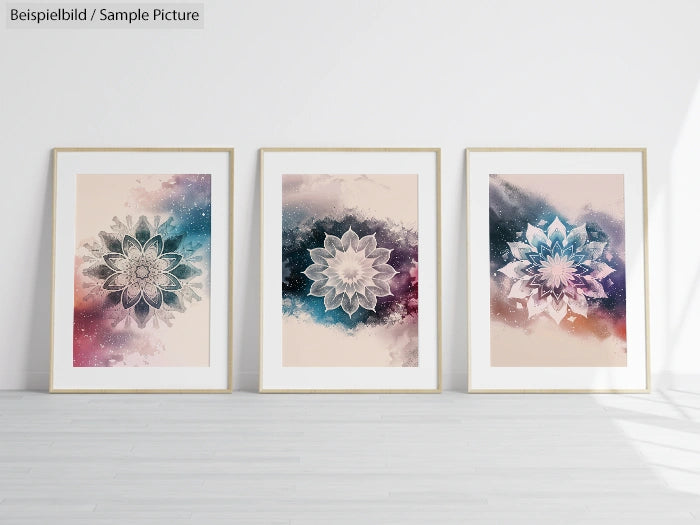 Three framed abstract floral art prints on a white wall, each featuring colorful galaxy-themed backgrounds.