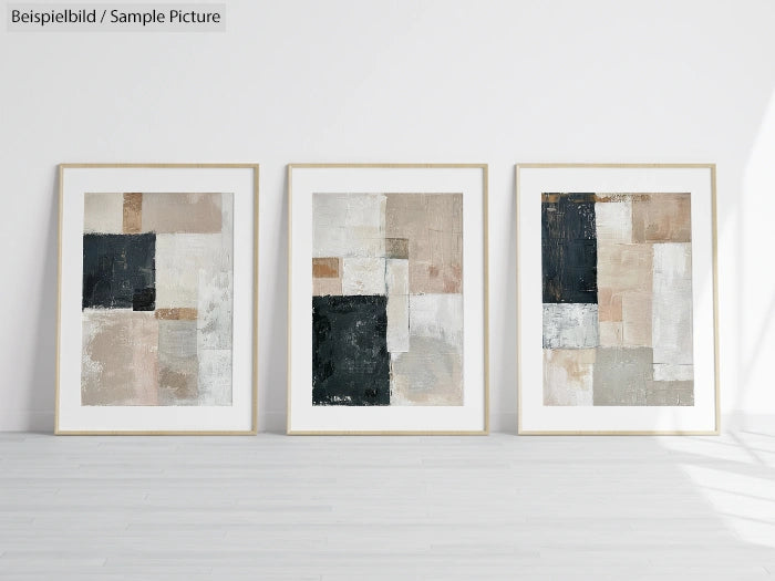 Gallery room with three abstract geometric paintings in neutral tones on a white wall.